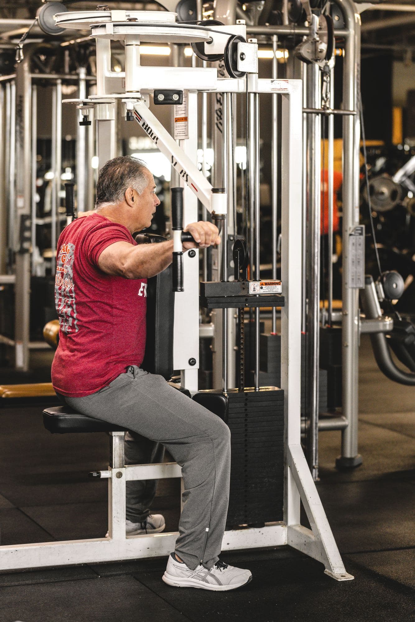 A member trains on a selectorized upper-body machine at an existing W.O.L.F. Gyms location (source photo Wolf Fitness Brig-2.jpg).